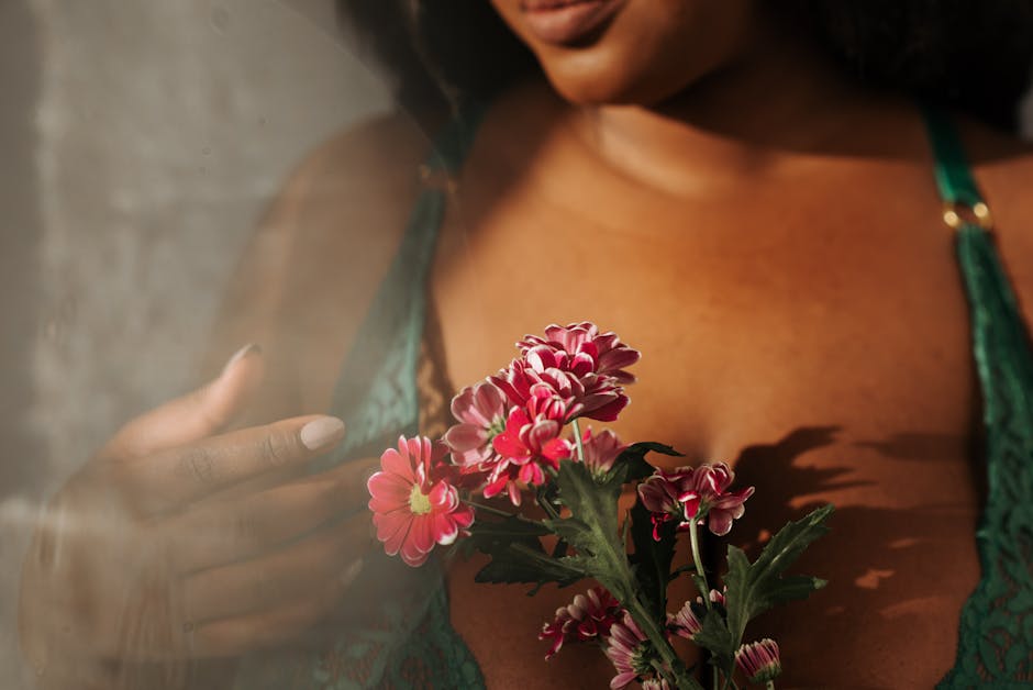 Intimate boudoir portrait with flowers and soft natural light