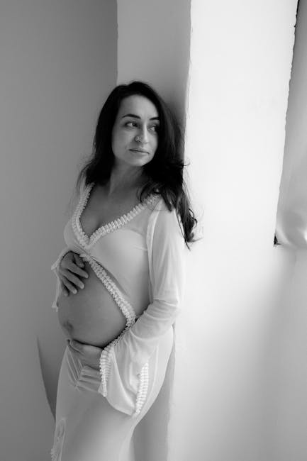 Elegant black and white maternity boudoir portrait